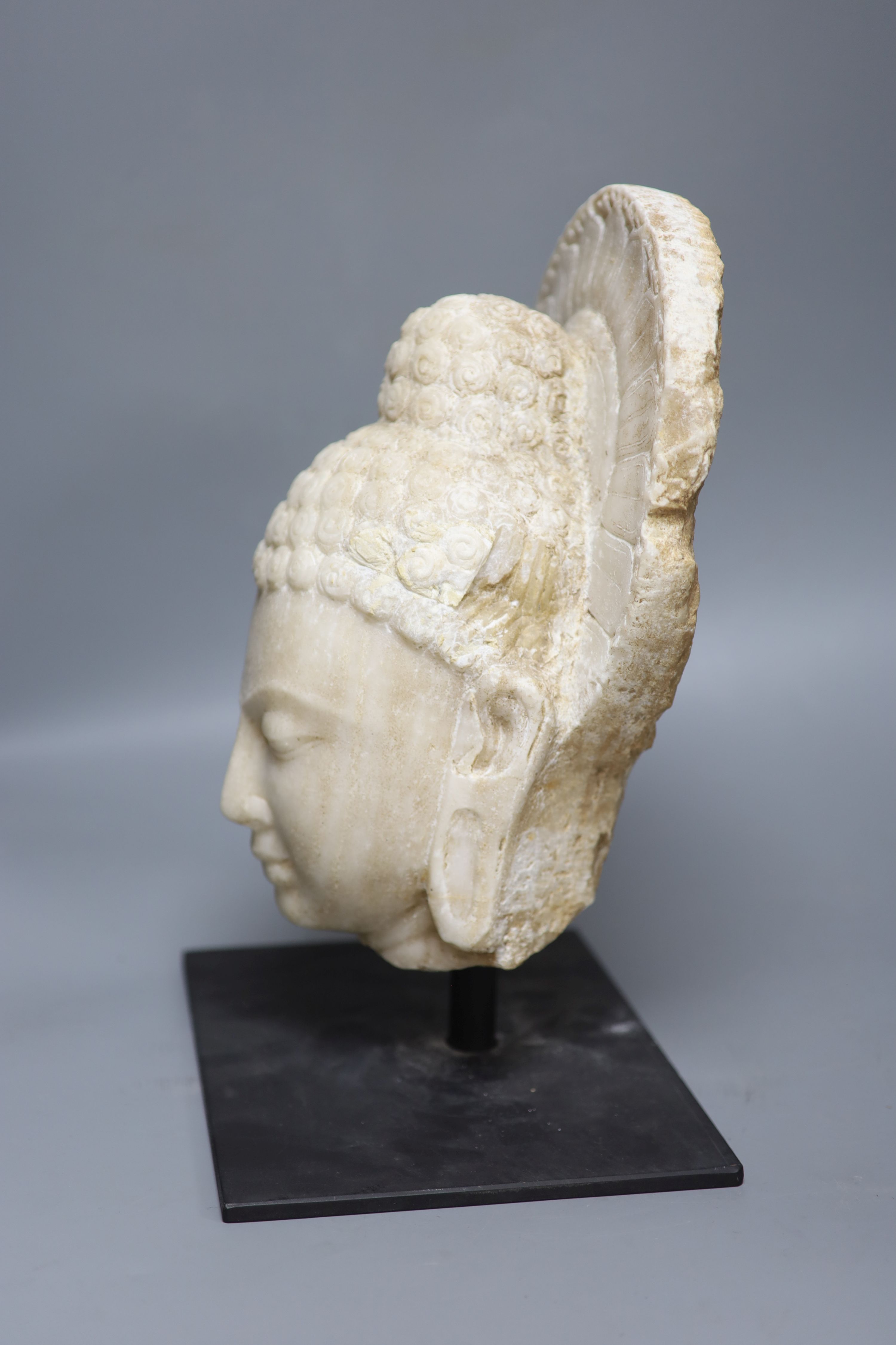 A Gandharan style alabaster head, height 37cm